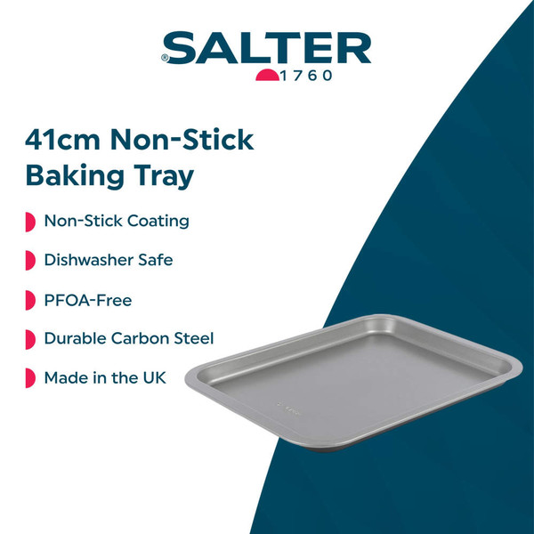 Non-stick grey bakeware set with roast chicken, vegetables, Yorkshires and cookies displayed.