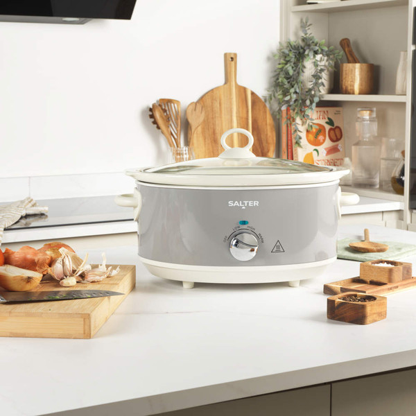 Grey Salter slow cooker with glass lid, shown cooking chilli in modern kitchen