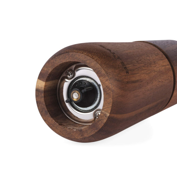 Close-up of brown wooden pepper mill base showing grinding mechanism