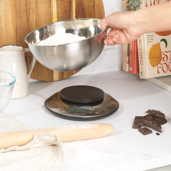 Digital kitchen scale with black mixing bowl and LCD display showing zero