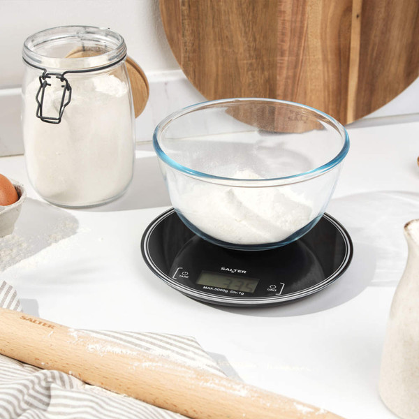 Salter digital kitchen scale with glass bowl of flour on worktop