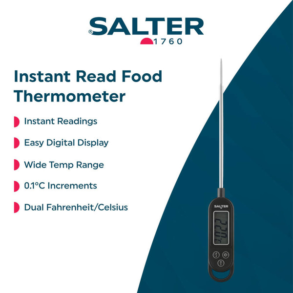 Digital meat thermometer checking temperature in cooked ham on kitchen worktop