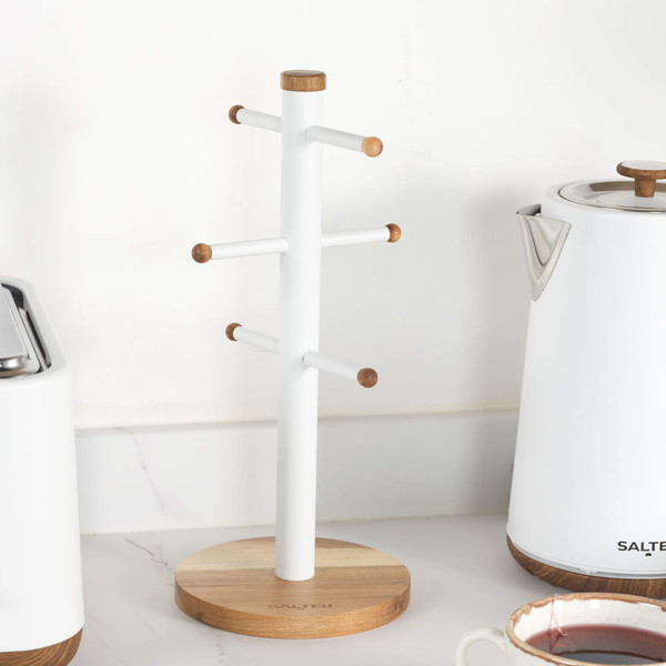White and bamboo mug tree stand on kitchen worktop