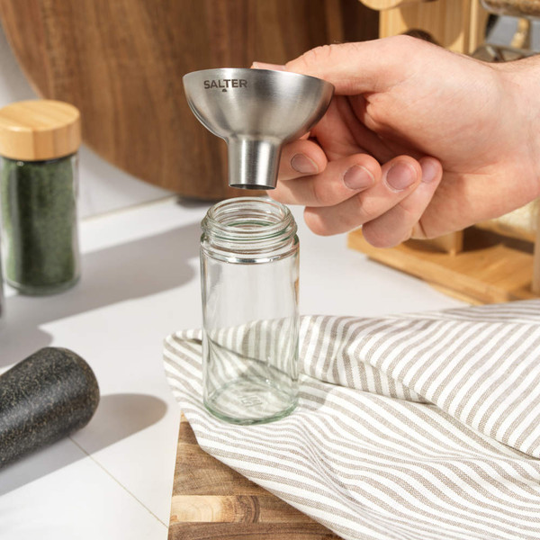 Stainless steel funnel angled on white background