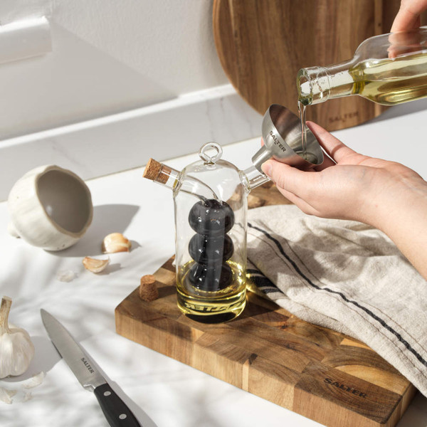 Stainless steel funnel angled with 'SALTER' branding, shown on white background