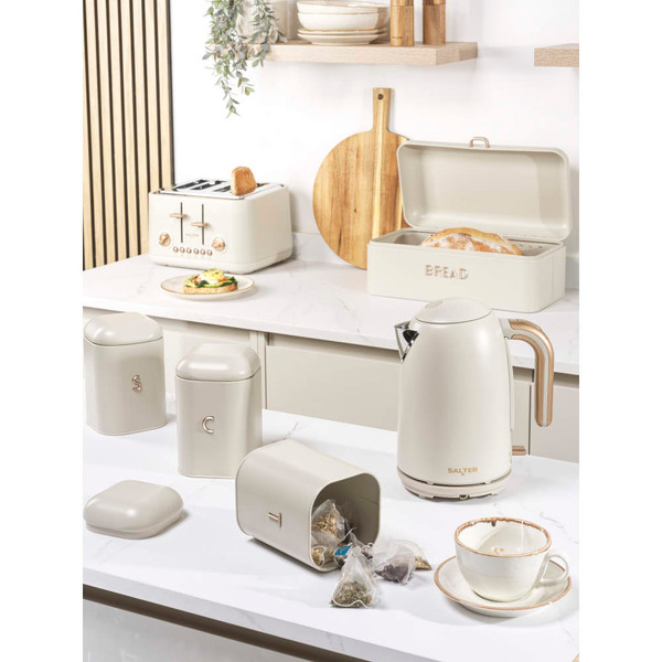 Cream kitchen set including kettle, toaster, bread bin, and storage jars on counter