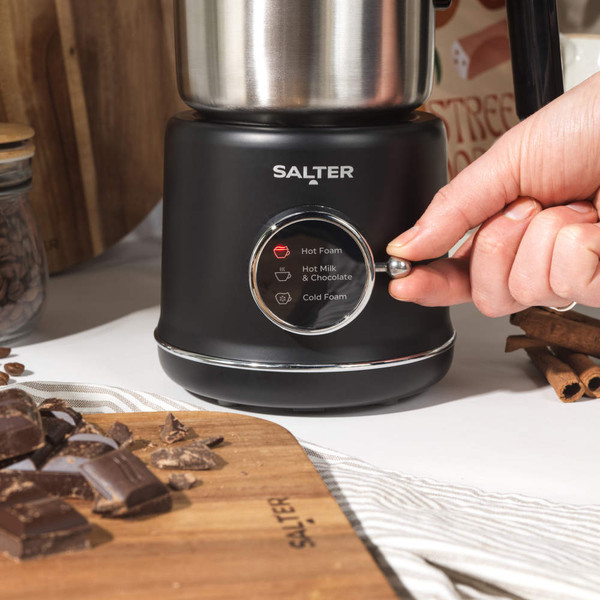 Top view of empty stainless steel electric kettle with black handle