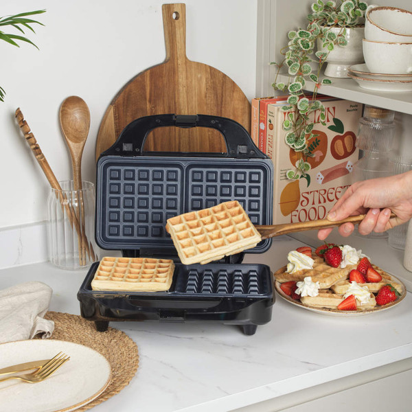Black 3-in-1 sandwich maker with open grill plates and interchangeable waffle and toastie plates