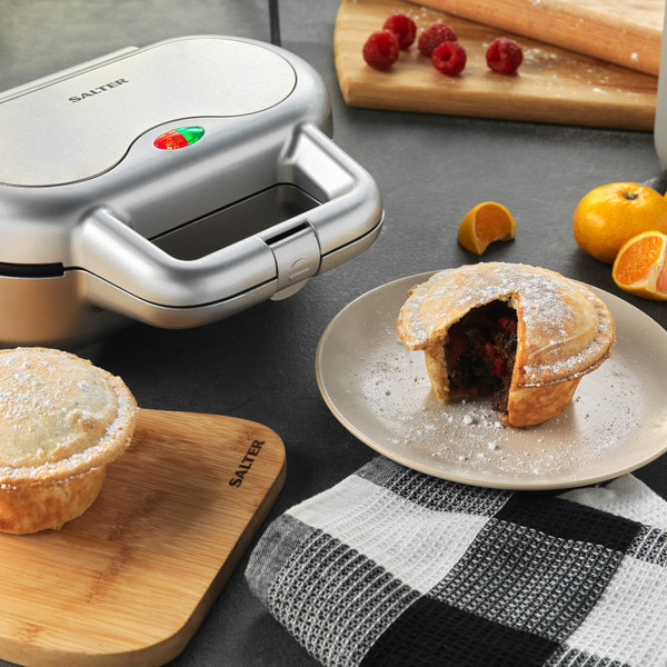 Salter silver pie maker with baked fruit pie on plate, kitchen setting