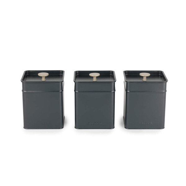 Set of three grey square storage canisters with silver knobs, for tea, coffee, and sugar.