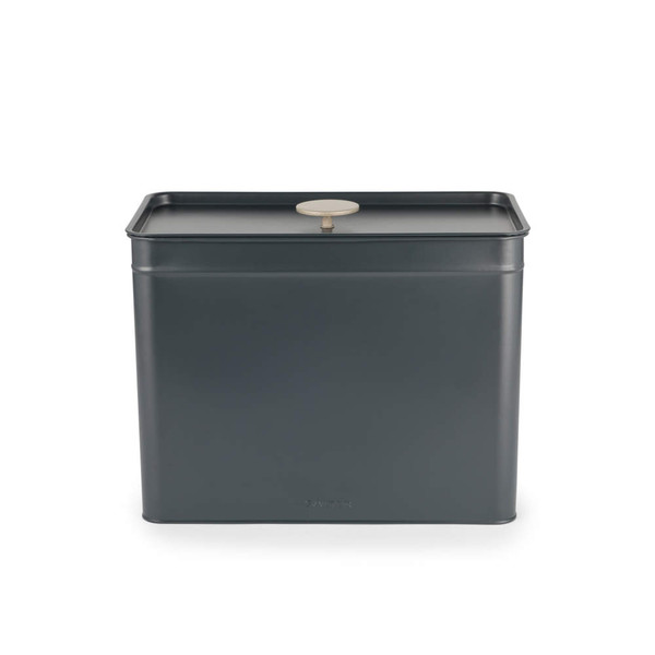 Black metal storage tin with flat lid and round handle, displayed front facing.