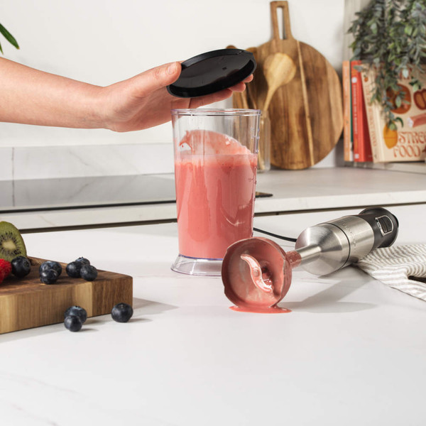 Clear measuring jug with black lid, 700ml capacity, shown upright on white background