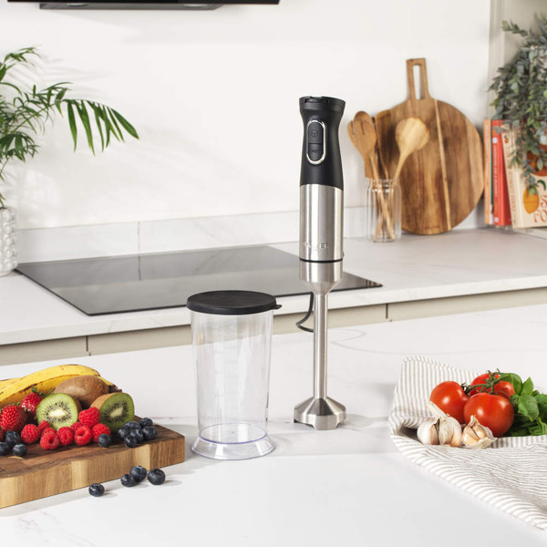 Stainless steel food processor blade, overhead view.