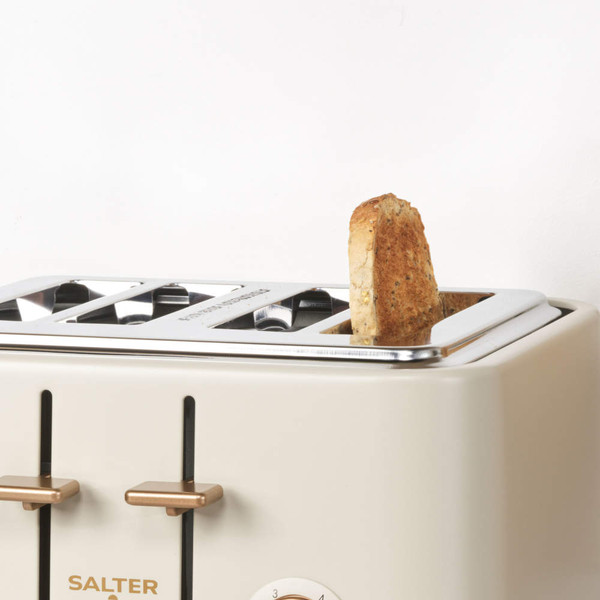 Cream 4-slice toaster with bronze controls, showing one slice of toasted bread