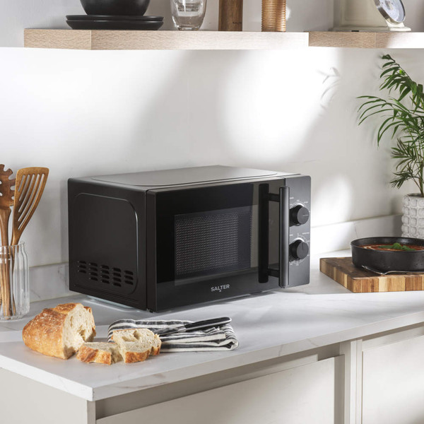 Black manual microwave, 20 litre capacity, shown in branded Salter box