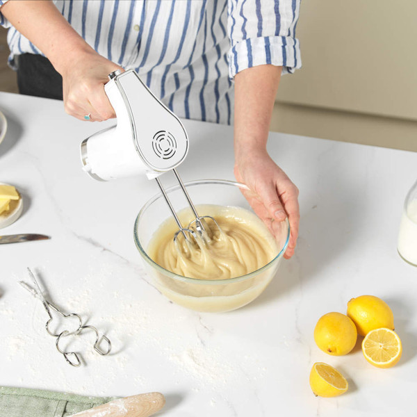 Pair of silver metal hand mixer beaters shown upright