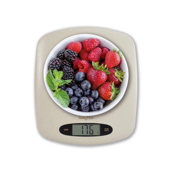 Digital kitchen scale in stone colour with bowl of mixed berries, showing weight 176g