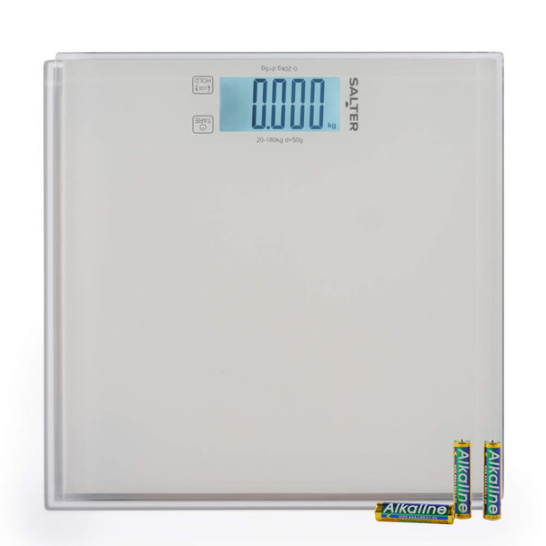Glass digital bathroom scale with LCD display, shown with four AA batteries included.
