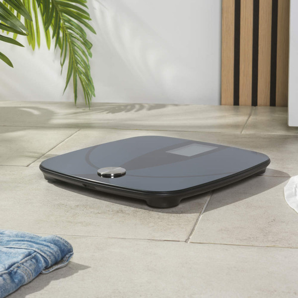 Black digital bathroom scale with Salter branding, top view, showing LCD display.