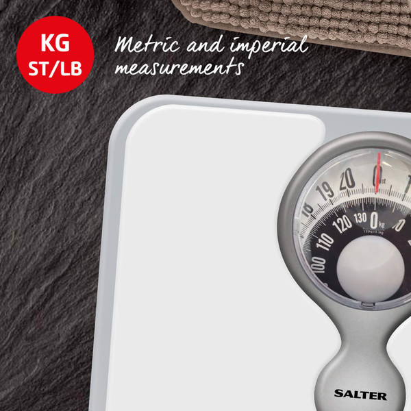 Mechanical bathroom scale showing KG, ST, LB units, silver and white with Salter branding