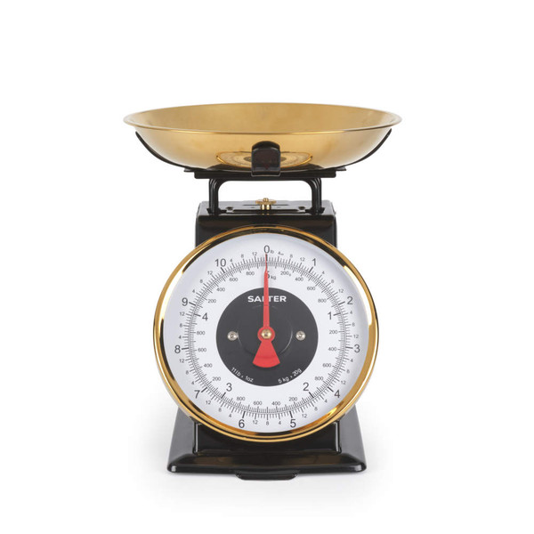 Black and gold mechanical kitchen scale with large round dial and gold weighing bowl
