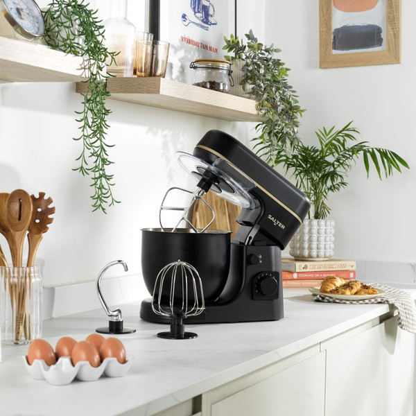 Black and gold Salter stand mixer, close-up showing mixing bowl and dial.