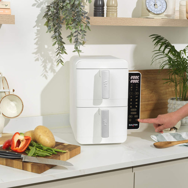 White electric kitchen appliance side view, showing vents and handles