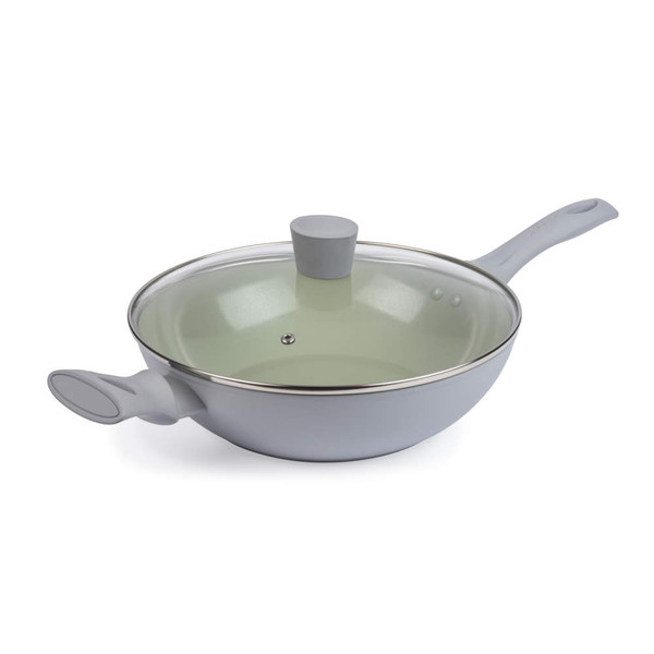 Light green non-stick wok with two grey handles and glass lid, shown at angle