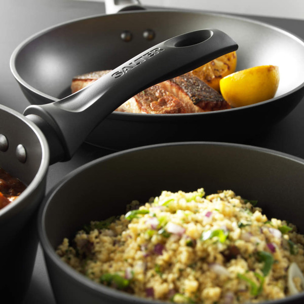 Salter non-stick grey frying pans shown with cooked food, angled for detail
