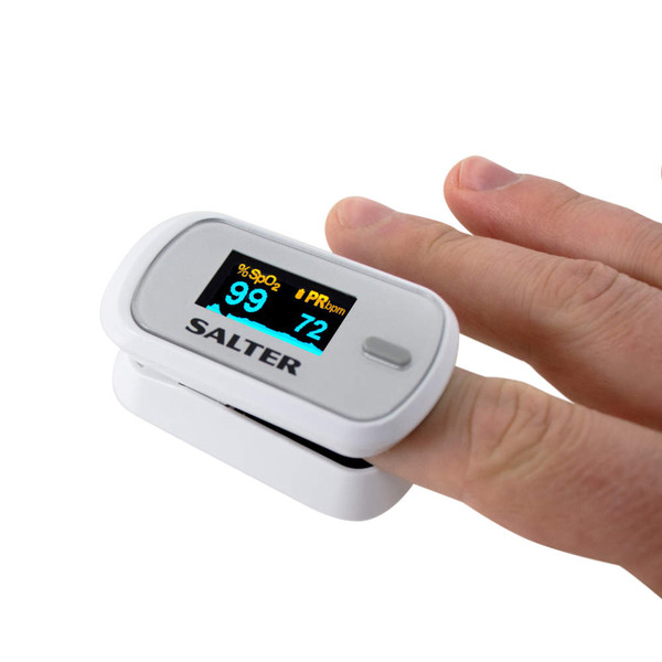 White Salter fingertip pulse oximeter in use, showing digital readout.