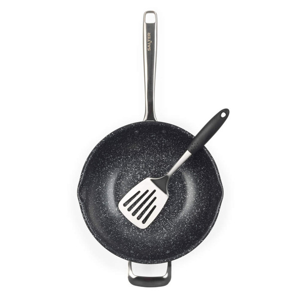 Black speckled non-stick wok with metal handle, shown with spatula inside, top-down view