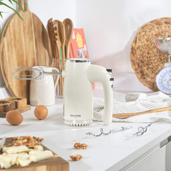 Cream retro hand mixer packaging showing product and features
