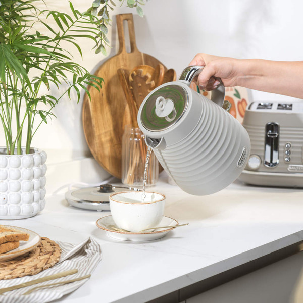 Taupe ribbed electric kettle with chrome handle, side water gauge, on white background