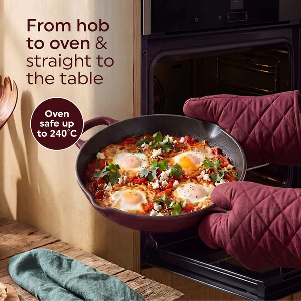 Purple non-stick frying pan cooking pancakes on induction hob, kitchen setting