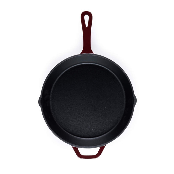 Black cast iron frying pan with red handle, shown from above