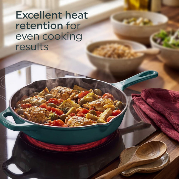 Green cast iron frying pan searing steak on induction hob