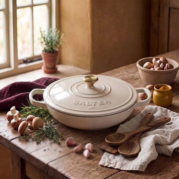 Cream cast iron casserole dish with handles, shown lid-on from above