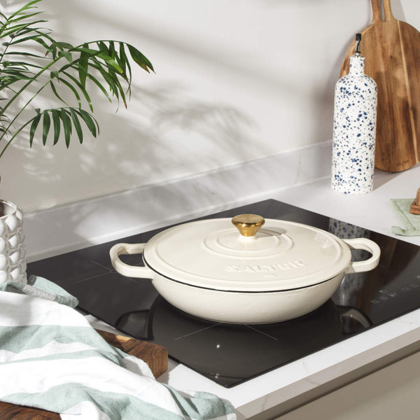 Cream cast iron casserole dish, base view with two handles