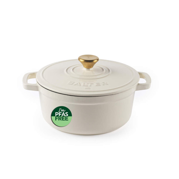 Cream cast iron casserole dish with gold knob, PFAS free badge on side