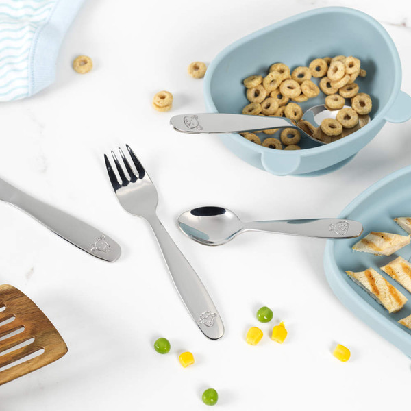 Children's silver cutlery set with animal motifs, showing fork, knife, spoon and teaspoon.