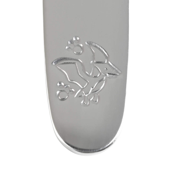Silver utensil handle with engraved flying dinosaur and bubbles motif