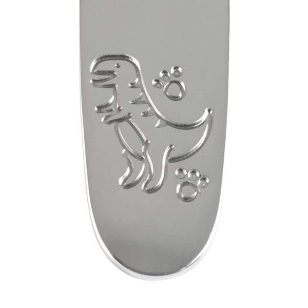 Children’s silver spoon handle with engraved dinosaur and paw prints