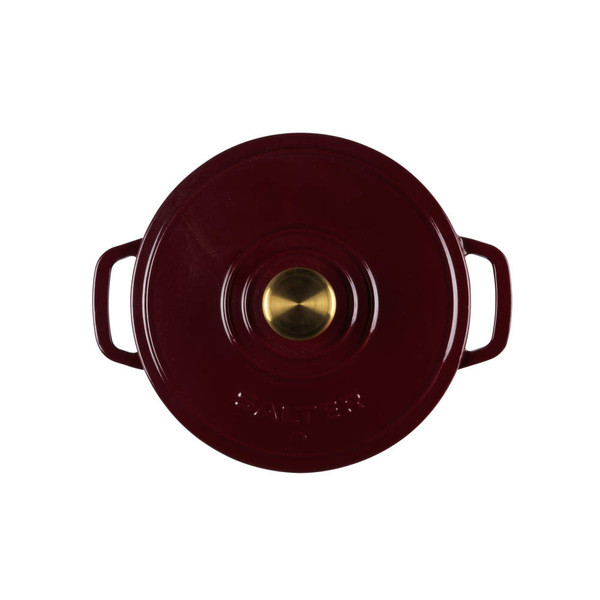 Red cast iron casserole dish with gold knob, seen from above