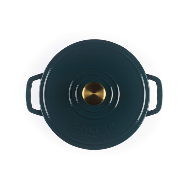 Green cast iron casserole dish with gold knob, top view