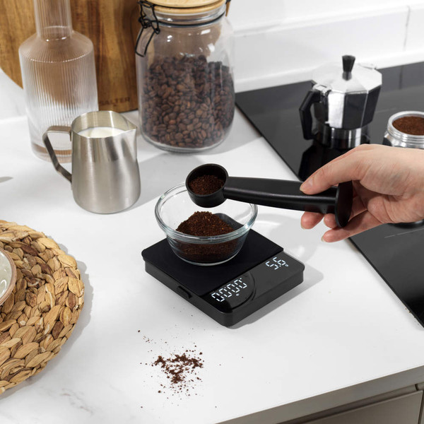Black digital kitchen scale with LED display, shown from above