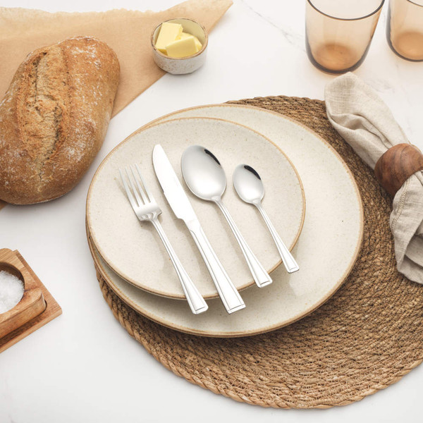 Set of four silver stainless steel cutlery pieces: knife, fork, tablespoon, teaspoon