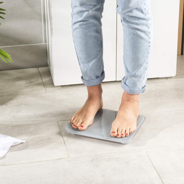 Grey digital kitchen scale with SALTER branding, square shape, angled product view