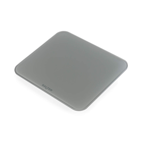 Person standing on grey digital bathroom scale, feet visible, light tile floor