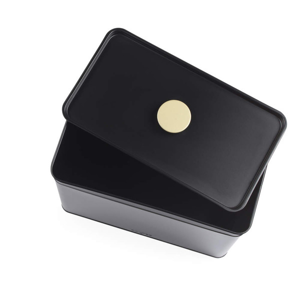 Black metal bread bin with hinged lid and gold knob, shown open from above.