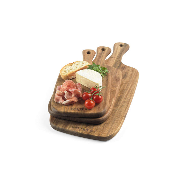 Set of three wooden serving boards with bread, cheese, ham, tomatoes and rocket.